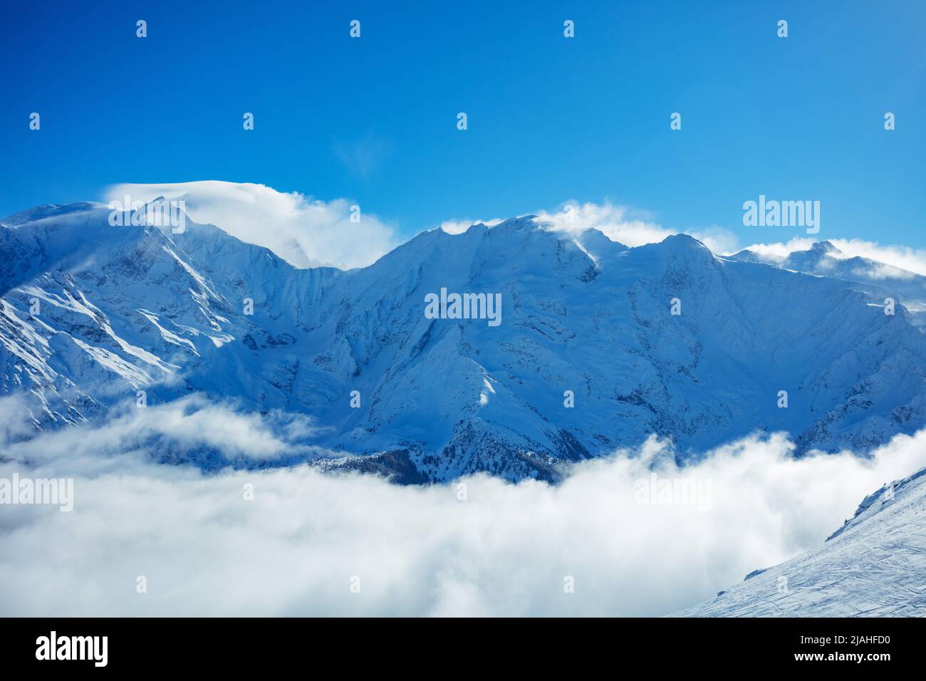 View above clouds of Alps mountains and Mont Blanc massif Stock Photo