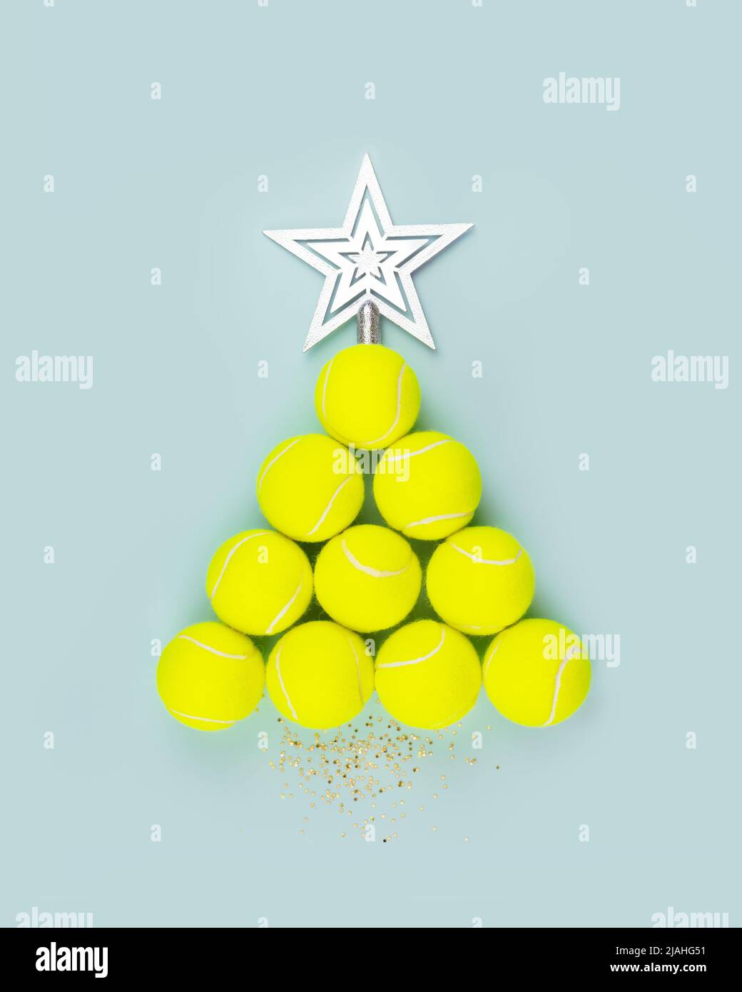 Tennis balls in the form of a New Year Tree with decorative star Stock Photo