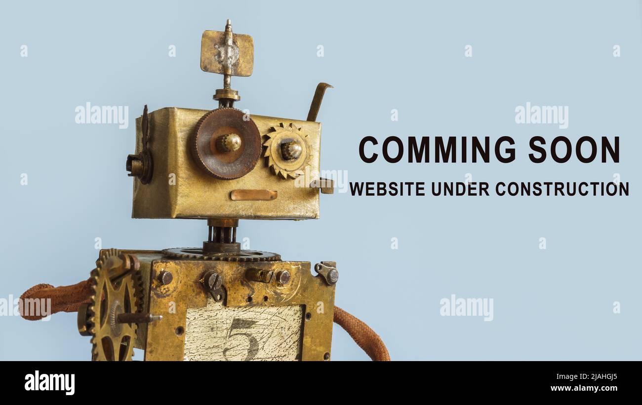 Rusty robot and sign Website coming soon. Under construction. Stock Photo