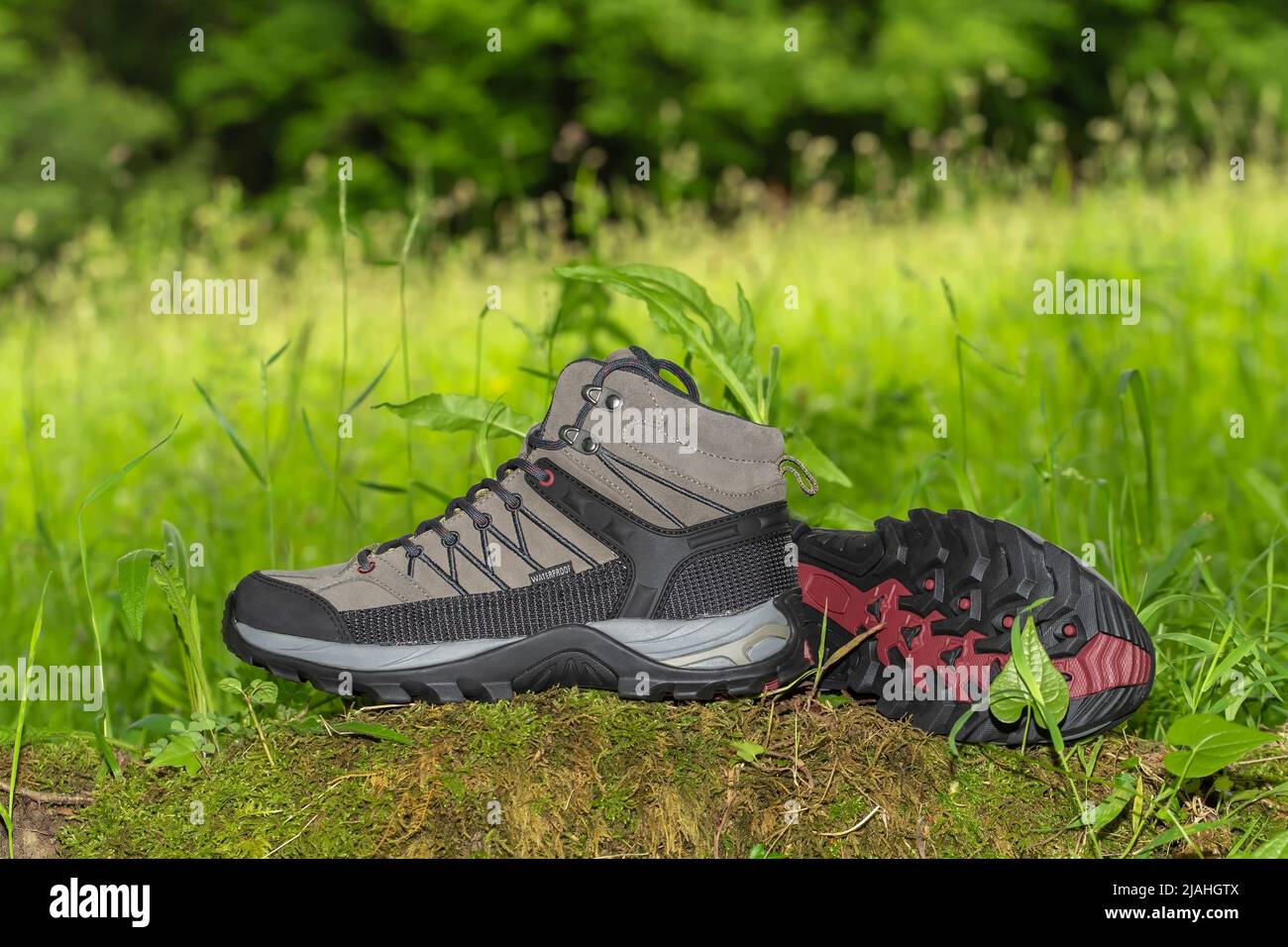 Modern waterproof mountain hiking boots with nature background Stock Photo Alamy
