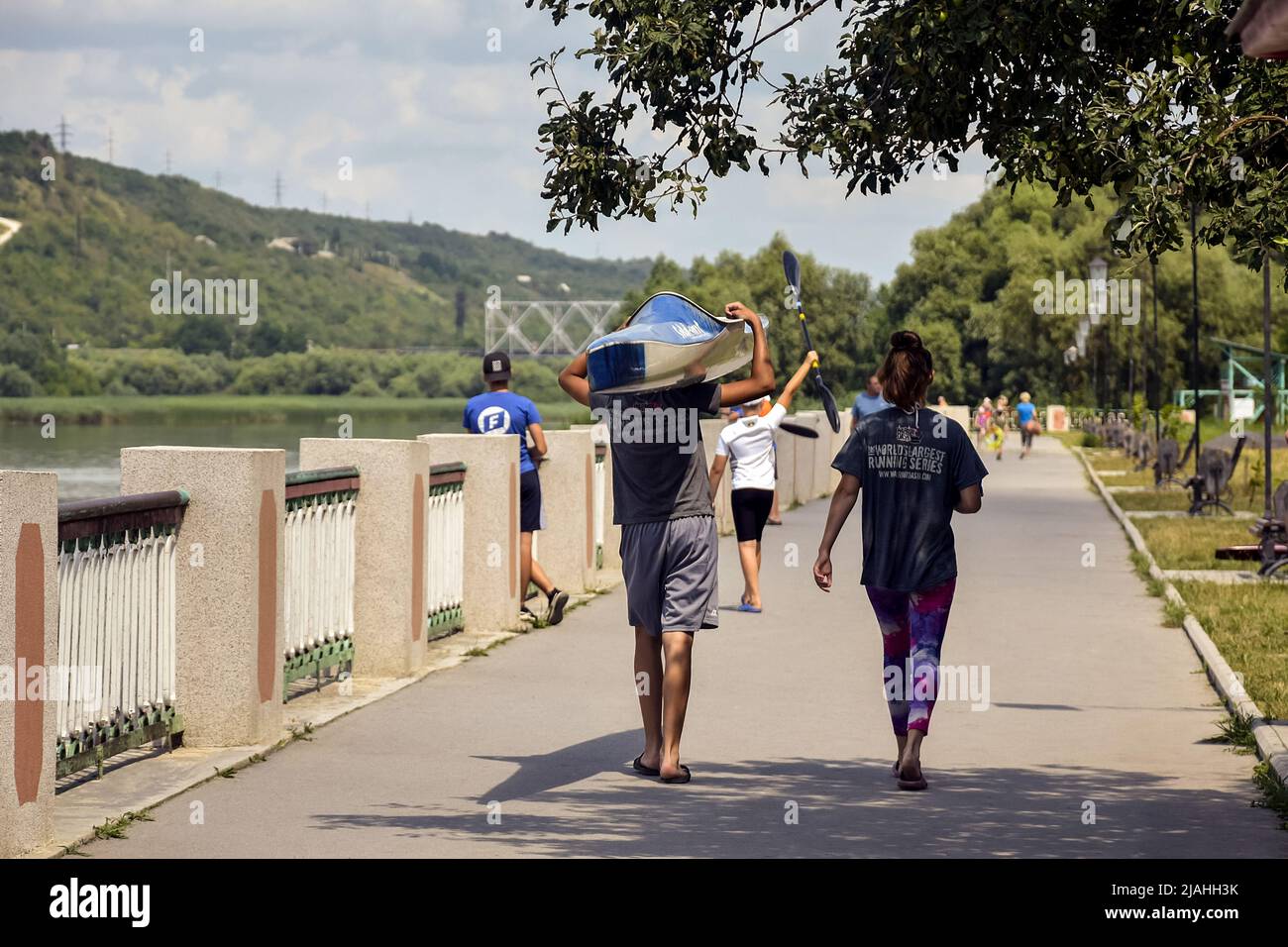 moldova-rybnitsa-july-2021-athletes-carry-kayaks-after-competition