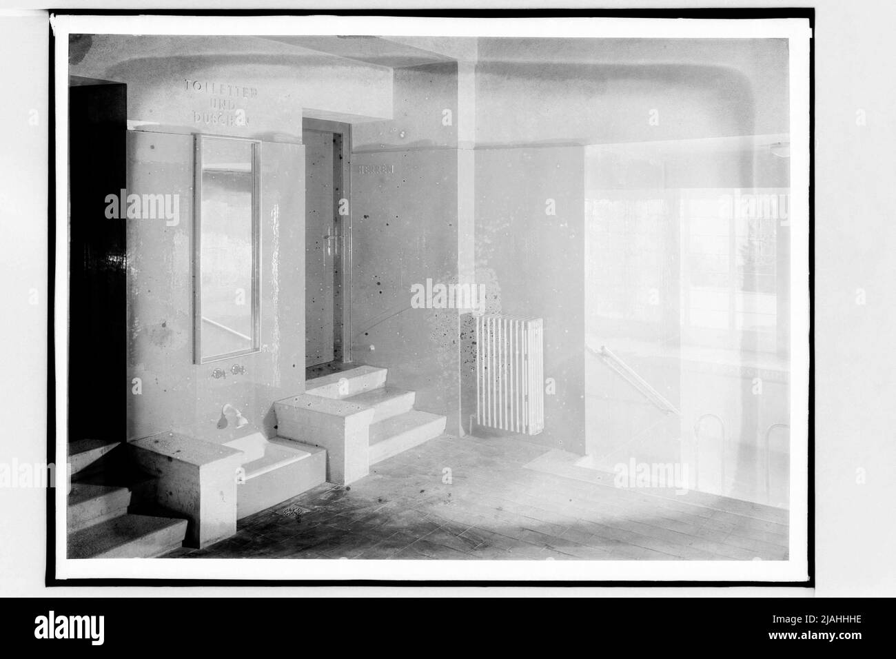 Indoor pool of the Südbahnhotel am Semmering: entrance to the toilets (architects: Emil Hoppe and Otto Schönthal) Stock Photo