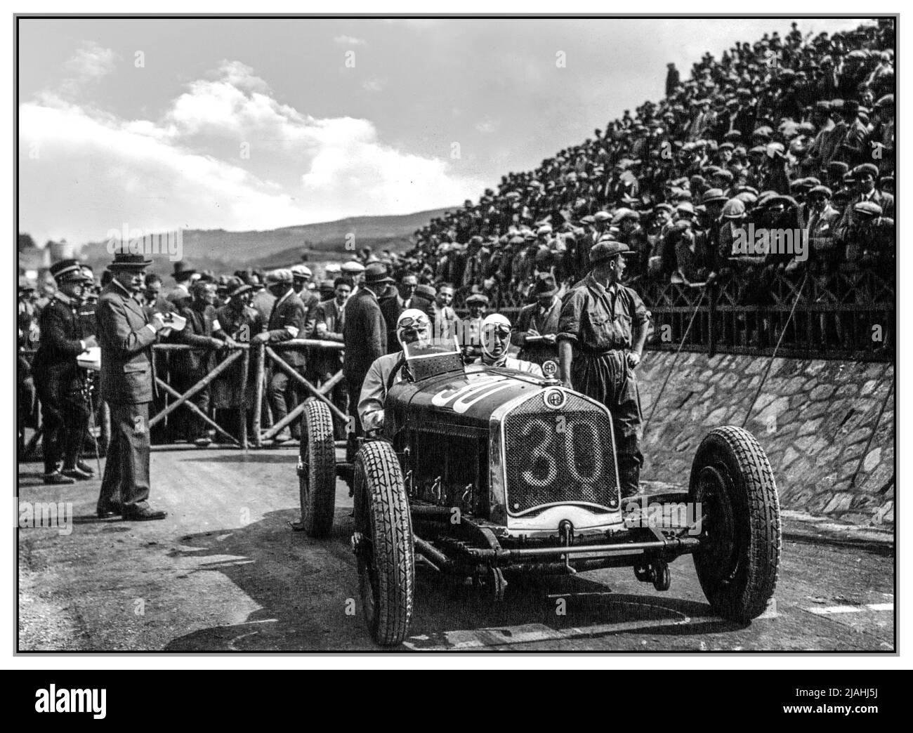 TARGA FLORIO Achille Varzi in his winning Alfa Romeo P2 at the 1930 Targa Florio. The 1930 Targa Florio was a non-championship Grand Prix motor race held on a 67 mile (108 km) course made up of public roads on the mountainous Italian island of Sicily. May 1930 The winner Achille Varzi in his Alfa Romeo P2 number 30 Stock Photo