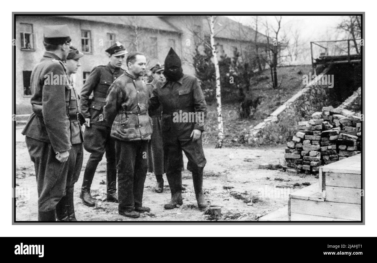 HOESS Camp Commandant Of Auschwitz Rudolf Hoess at the gallows, with hooded executioner. Taken prisoner by the British, he was handed over to the Poles tried sentenced to death, and taken back to Auschwitz and there within site of the block houses hanged. Nazi Hoess was in charge of the huge extermination camp in Poland where the Nazis murdered some three million Jews, from the time of its creation (he was responsible for building it) in 1940 until late in 1943, by which time the mass exterminations were well underway. Stock Photo