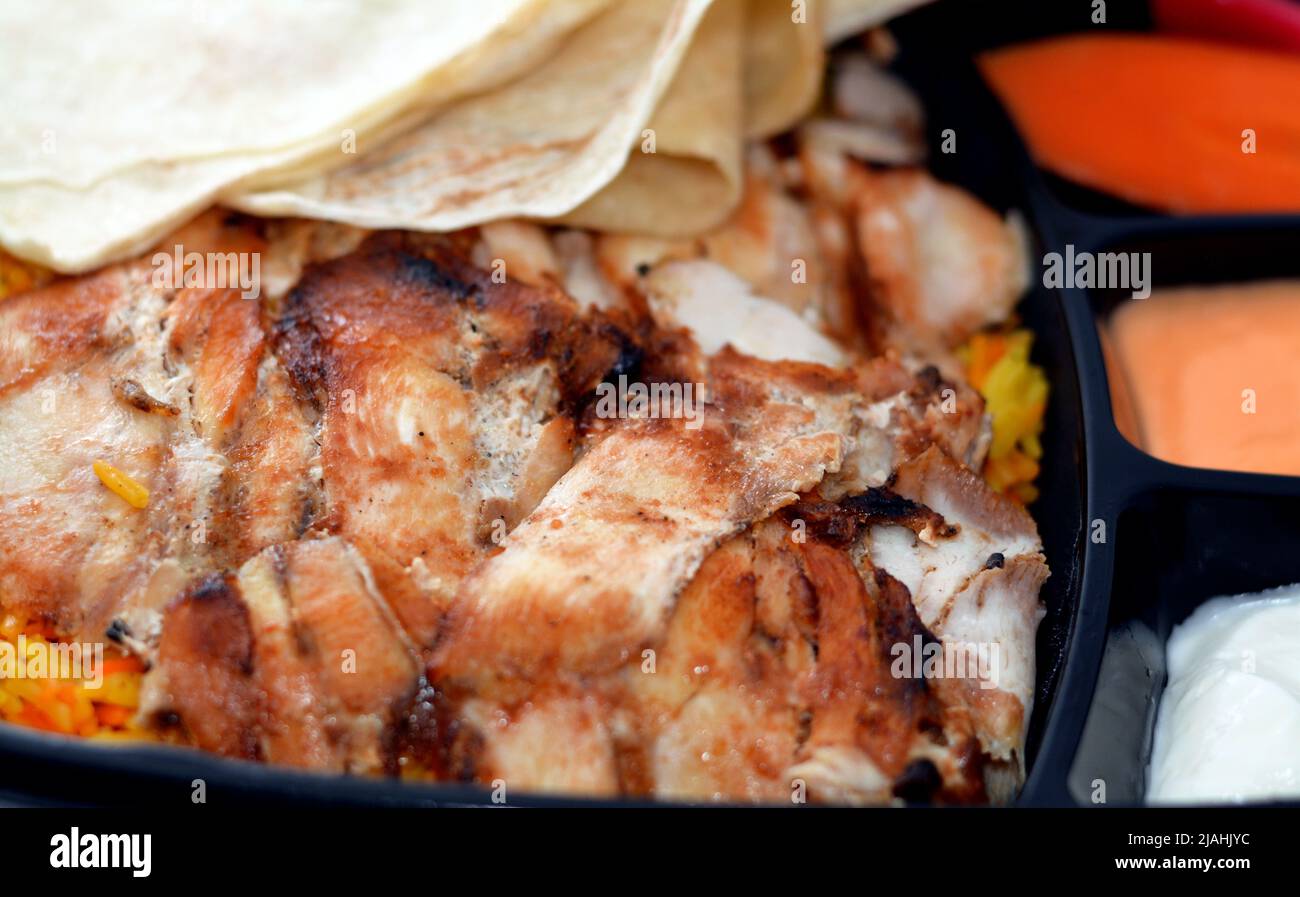 Arabic Syrian cuisine of Chicken Shawarma Fatteh colorful Basmati rice