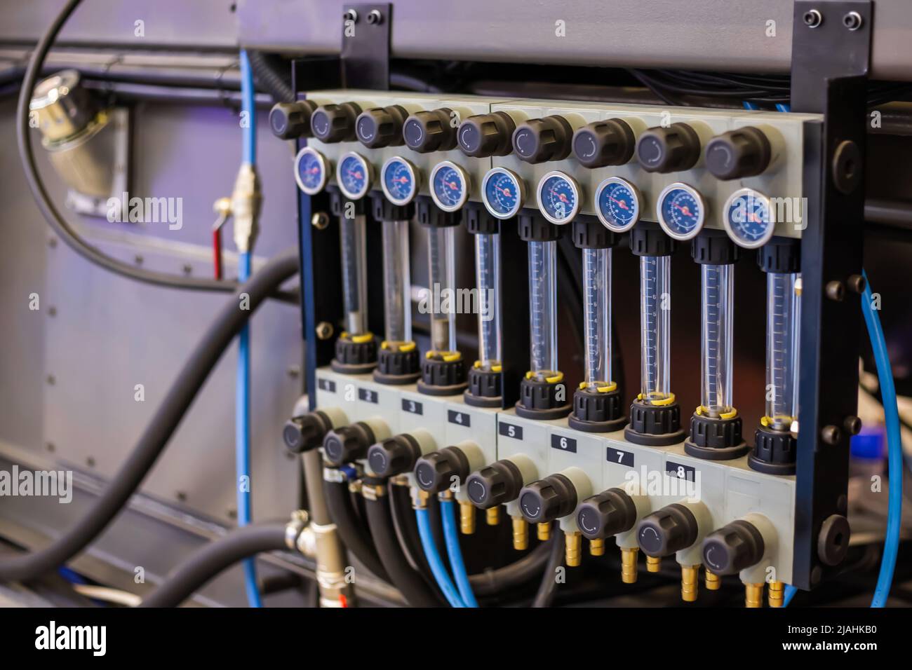 Flowmeter, rotameter - flow regulator for cooling system of injection machine Stock Photo