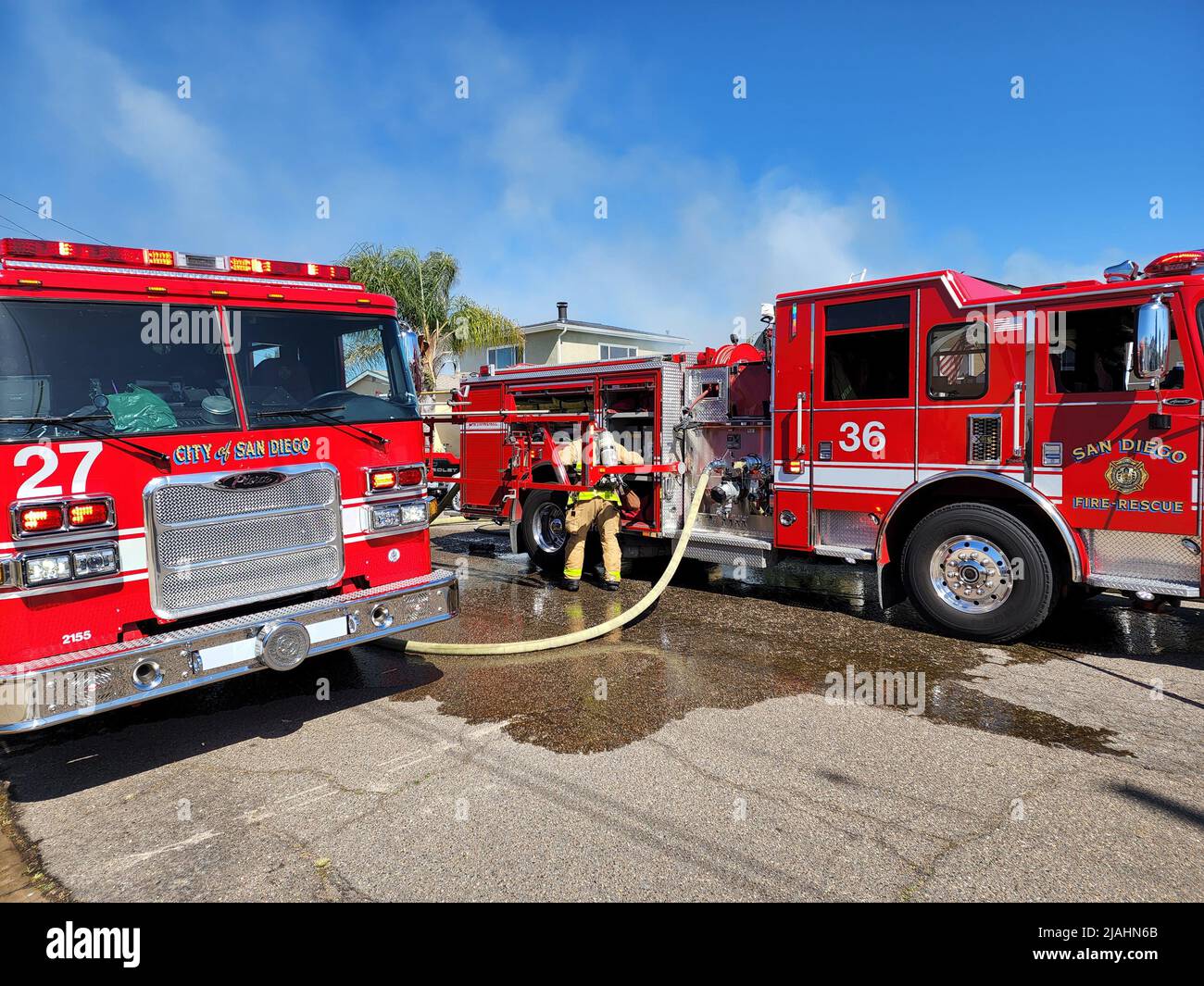SDFD Engine 36 and Engine 27 at the scene of a residential structure fire Stock Photo