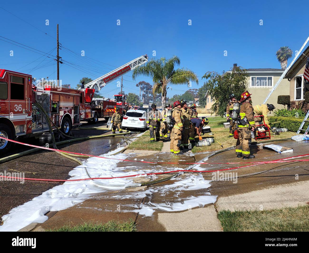 San Diego Fire-Rescue firefighters on scene at a residential structure fire Stock Photo