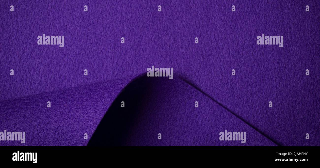 Abstract purple geometric felt texture background. Creative geometric curved felt textile background with copy space. Top view Stock Photo
