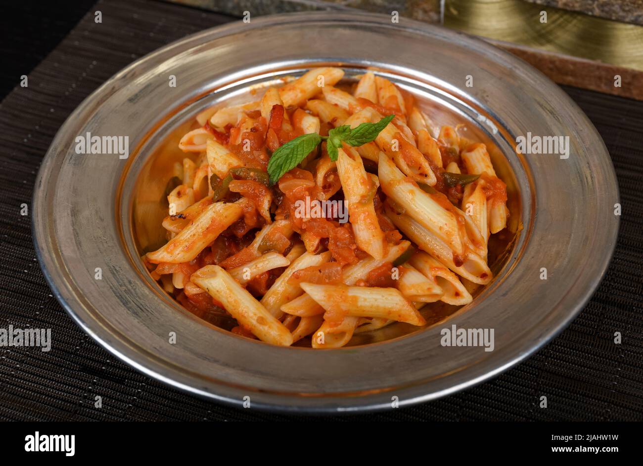 Penne pasta in tomato sauce with chicken and tomatoes Stock Photo - Alamy
