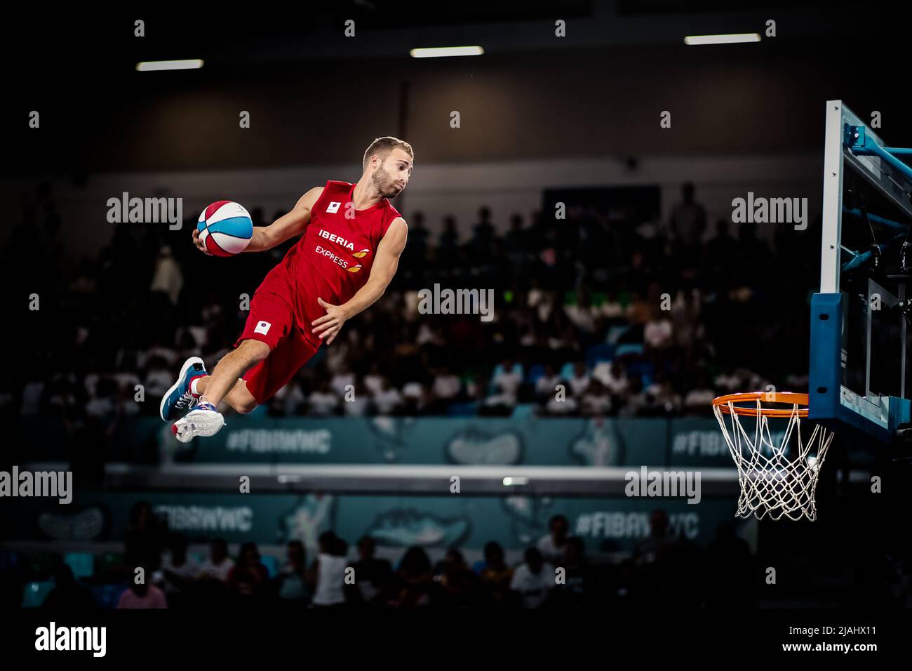 Tenerife, Spain, September 26, 2018:basketball player with ball in hands fly high during an acrobatic basketball show Stock Photo