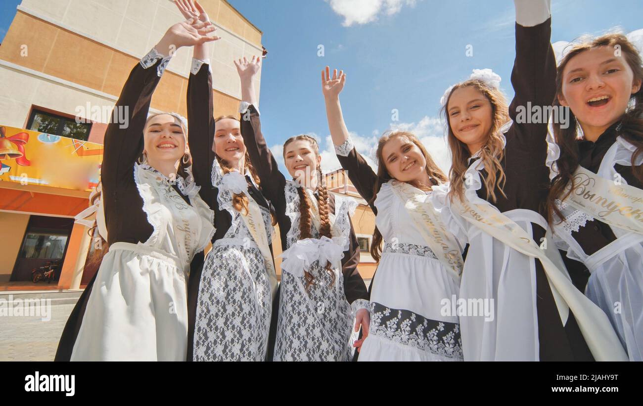 Russian Graduation Happy Russian school graduates are stretching their hands on their last ...
