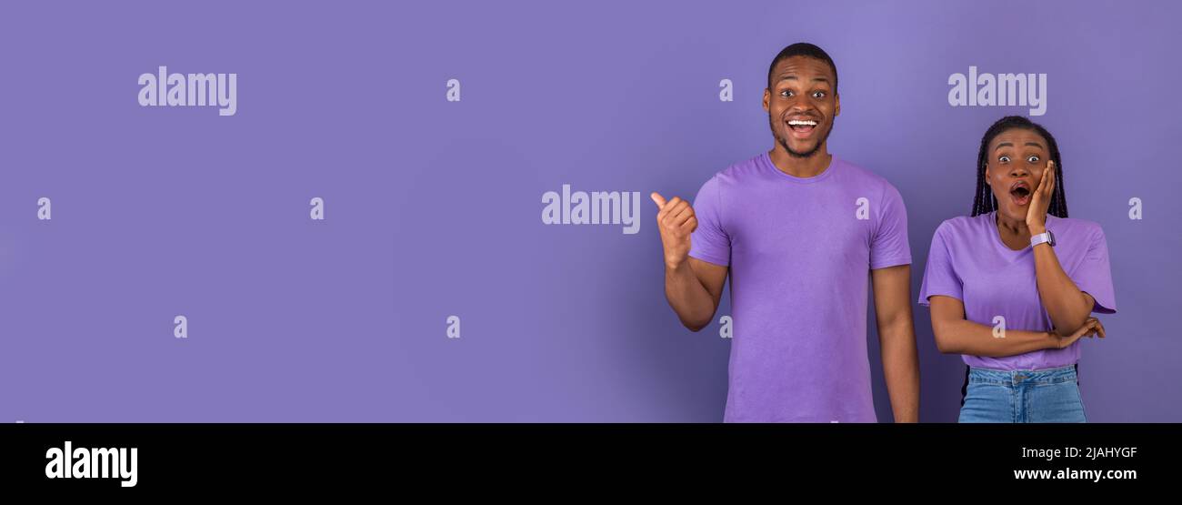 Excited black couple presenting hi-res stock photography and images - Alamy