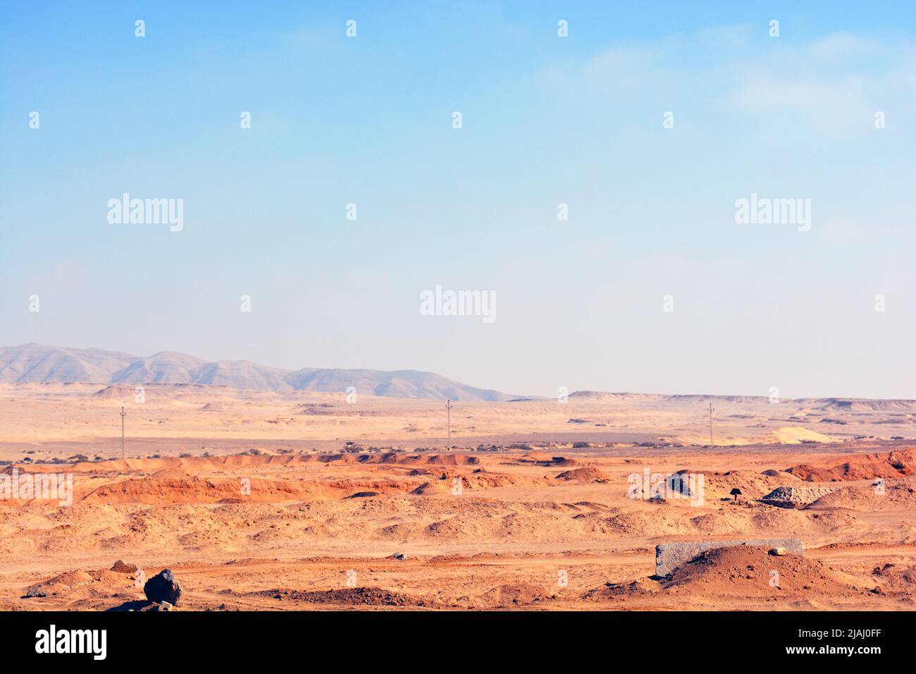 The Eastern desert of Egypt with mountains, sand and the sky, Selective focus of Sinai desert with chains of mountains and hills near Suez road and ci Stock Photo
