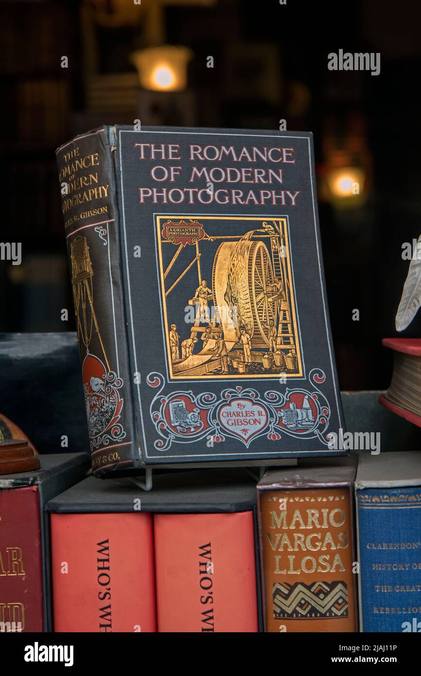 Vintage copy of 'The Romance of Modern Photography' by Charles R Gibson in the window of a secondhand bookseller in Edinburgh, Scotland, UK. Stock Photo