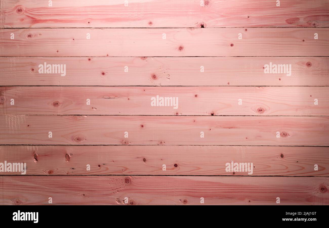 The Pink wood texture with natural patterns. Cherry tree wood background. Panoramic aged pinky wooden floor. Stock Photo