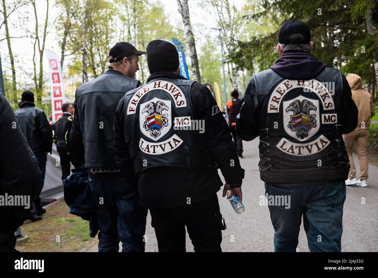 Estonian Motorcycle Season Opening. Men with 'Free Hawks Latvia' leather jackets. Motorcyclist gathering parade or rally. Stock Photo