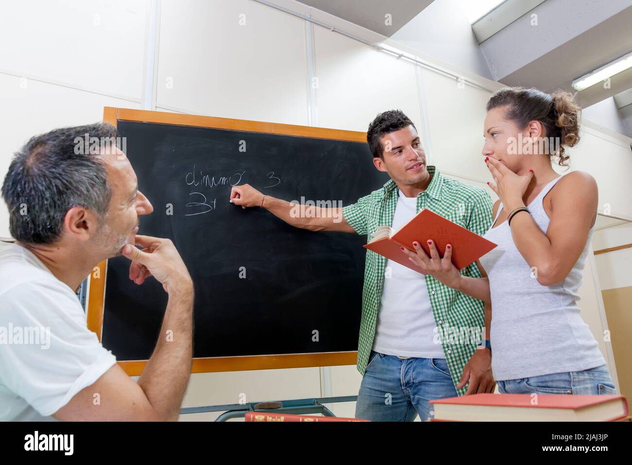 back to school - student suggests the answer friend Stock Photo - Alamy