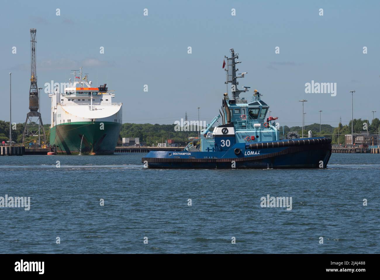 Marchwood, Southampton, England, UK. 2022. Tug Lomax passing Marchwood Military Port. Southampton Water. Stock Photo