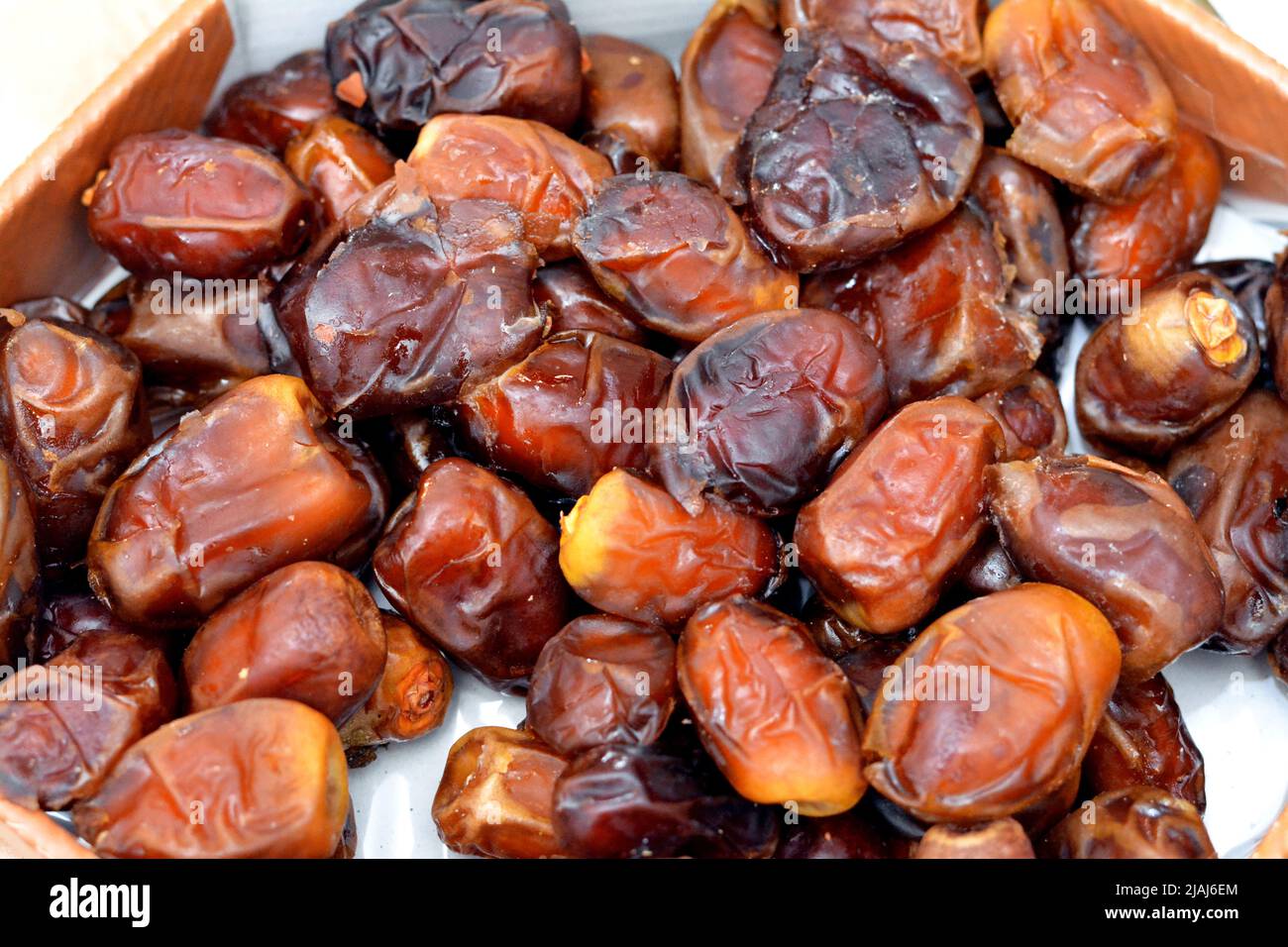 A background of wet dates fruits that is used in Ramadan month, the