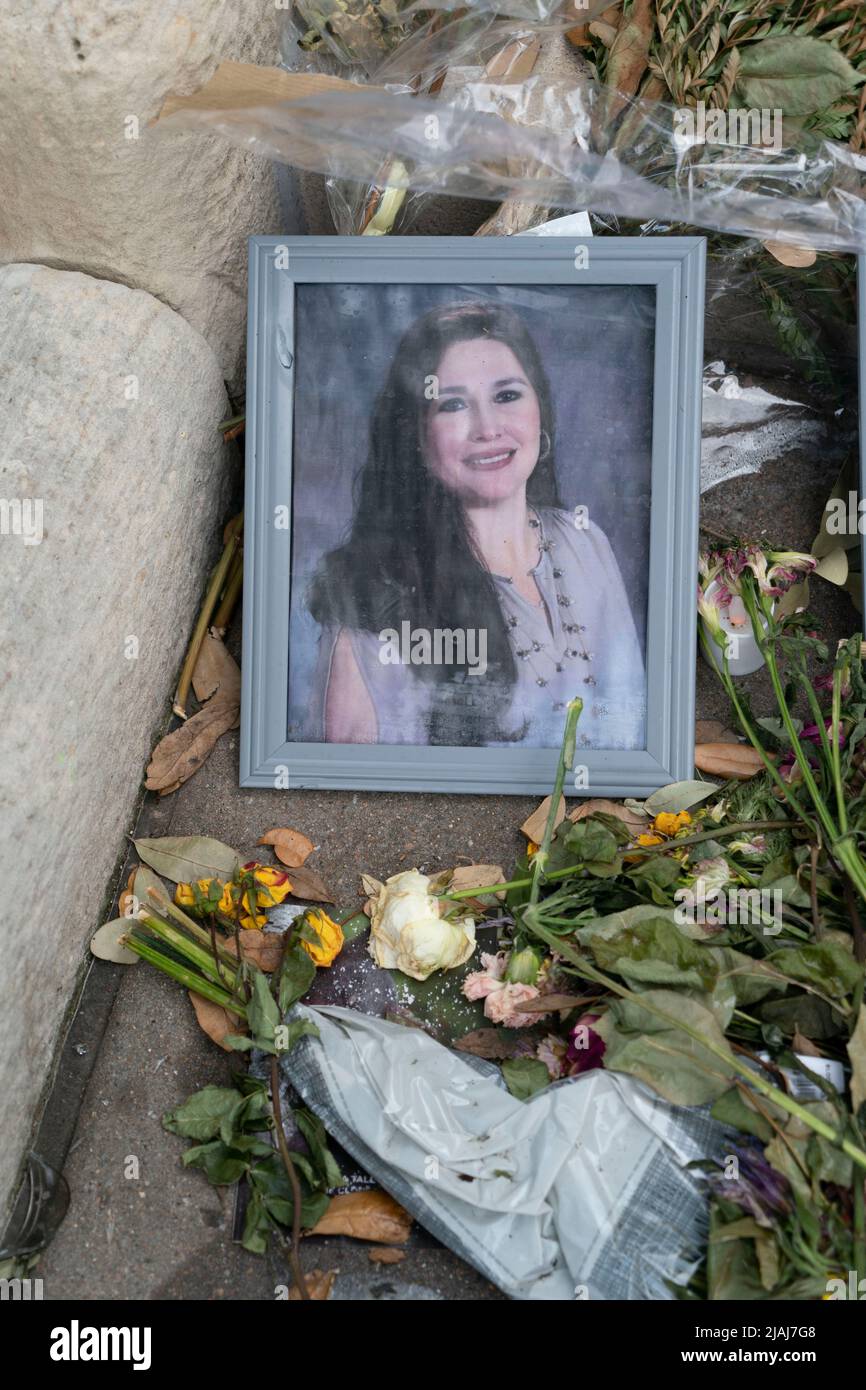 Austin Texas USA, May 30 2022: Photos of most of the 21 victims killed in last week's Uvalde, Texas USA school shooting, including teacher Irma Garcia, lie among candles and flowers at a makeshift memorial on the steps to the Texas State Capitol. Credit: Bob Daemmrich/Alamy Live News Stock Photo