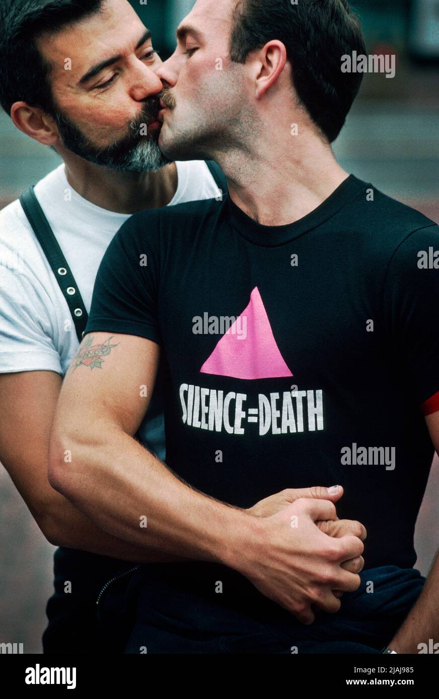 File Photo: Two men kissing during ACT UP / San Francisco demonstration in Central San Francisco, California, USA. 1990 Stock Photo