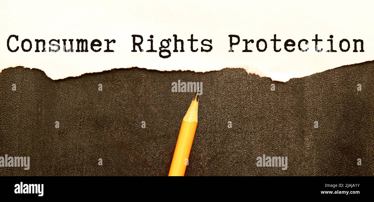 consumer protection, red notepad with text on the table. Stock Photo