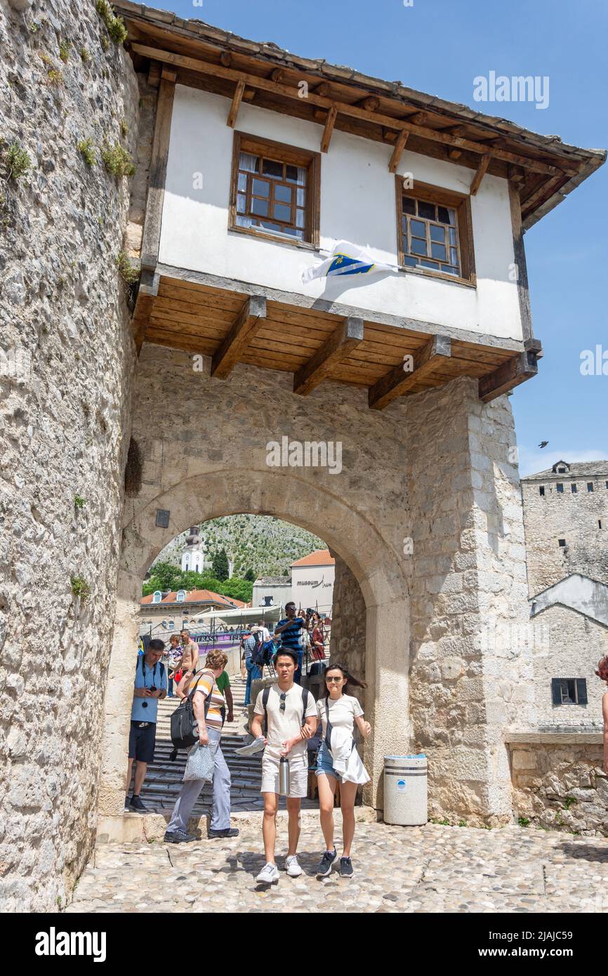 Stari Most Museum and gate to Stari Most (Mosta Bridge) over River Neretva, Old Town, Mostar, Bosnia and Herzegovina Stock Photo