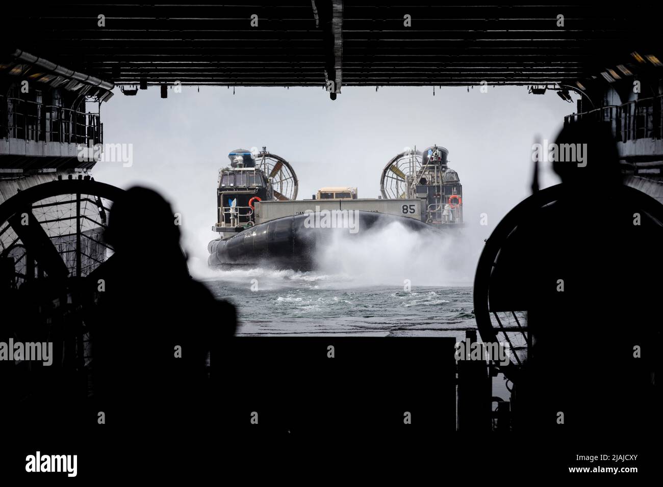 BALTIC SEA (May 21, 2022) – Landing Craft, Air Cushion 85, attached to Assault Craft Unit 4, approaches the well deck of the Wasp-class amphibious assault ship USS Kearsarge (LHD 3) May 21, 2022. Kearsarge, flagship of the Kearsarge Amphibious Ready Group and embarked 22nd Marine Expeditionary Unit, is participating in the Estonian-led exercise Siil 22 (Hedgehog 22 in English). Hedgehog 22 brings together members of the Estonian Defense Force and U.S. Sailors and Marines under Task Force 61/2 to enhance Allied interoperability and preserve security and stability in the Baltic region. (U.S. Nav Stock Photo