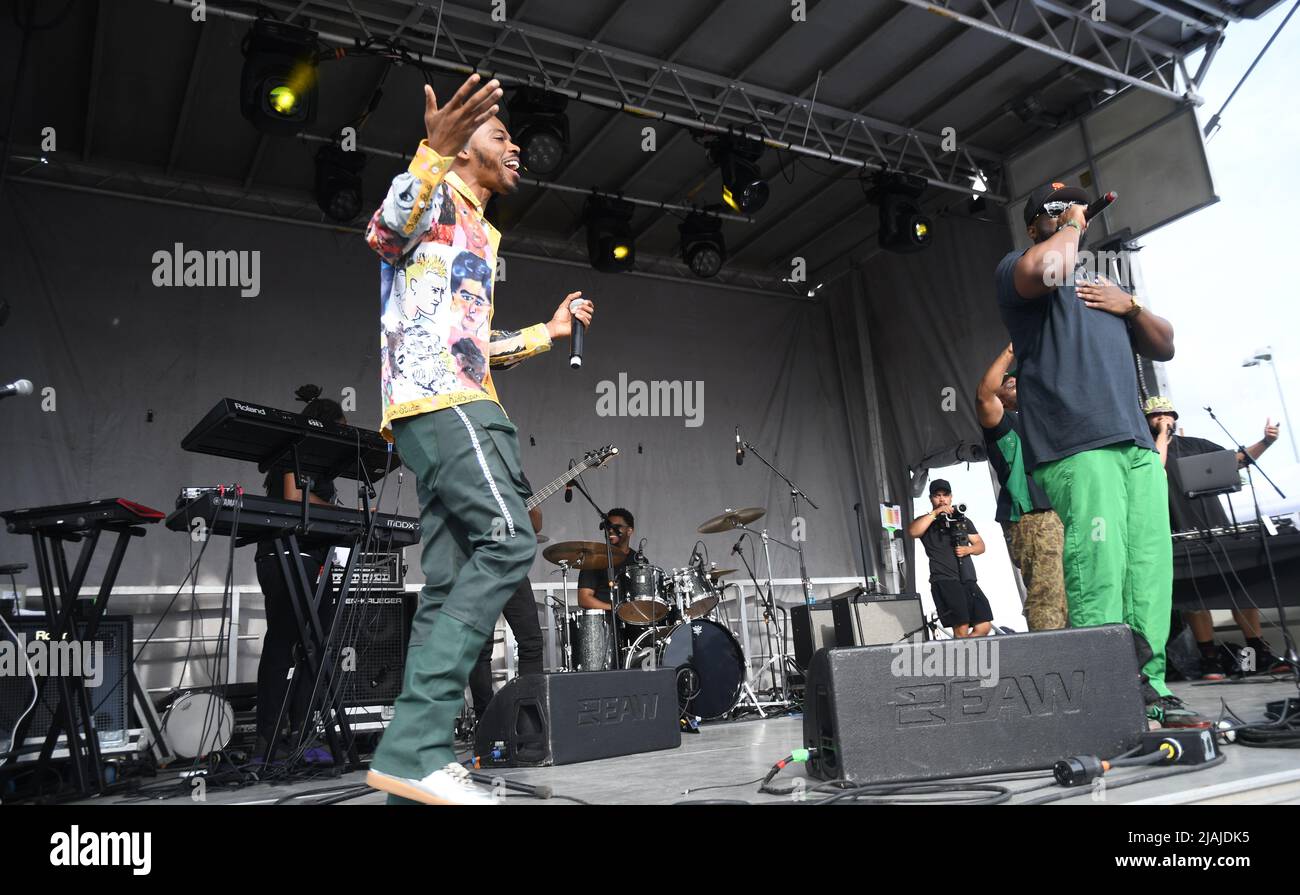 Rapper Avenue is shown performing on stage during a live concert ...