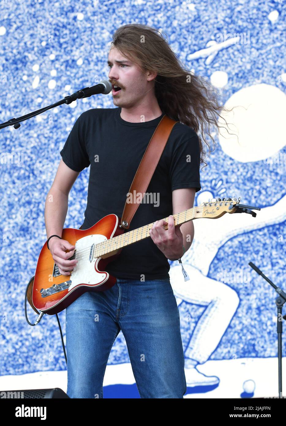 Singer, songwriter and guitarist Joshua Harmon is shown performing on