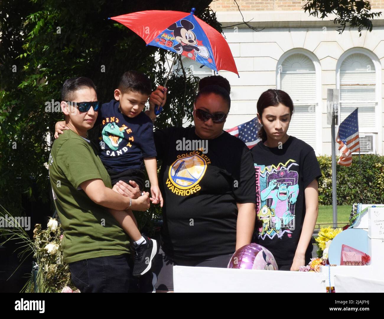 Uvalde, United States. 30th May, 2022. Mourners gather at a memorial of flowers at Robb Elementary School in Uvalde, Texas on Monday, May 30, 2022. A mass shooting days before left 19 children and two adults dead at the elementary school. Photo by Jon Farina/UPI Credit: UPI/Alamy Live News Stock Photo