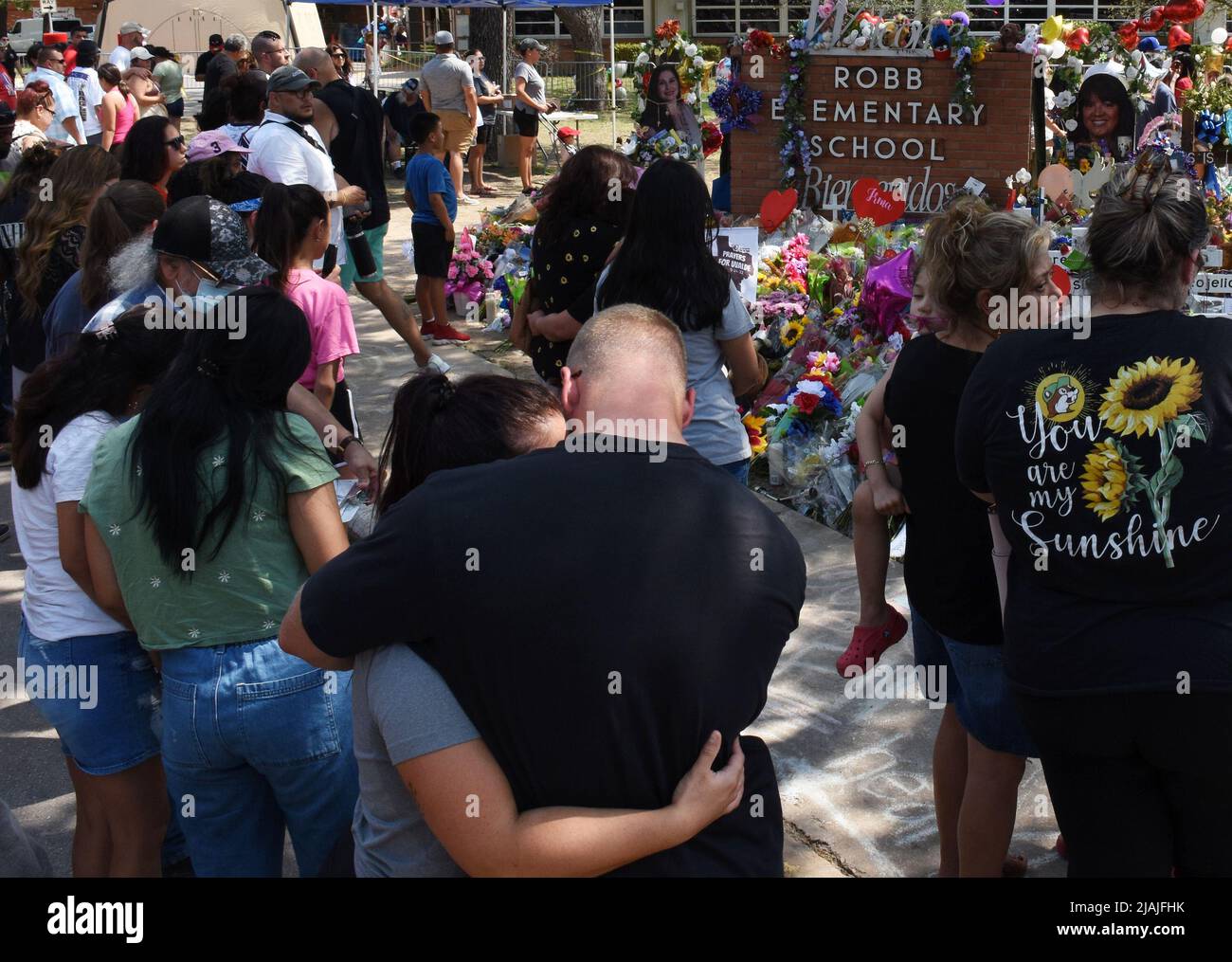 Uvalde, United States. 30th May, 2022. Mourners gather at a memorial of flowers at Robb Elementary School in Uvalde, Texas on Monday, May 30, 2022. A mass shooting days before left 19 children and two adults dead at the elementary school. Photo by Jon Farina/UPI Credit: UPI/Alamy Live News Stock Photo
