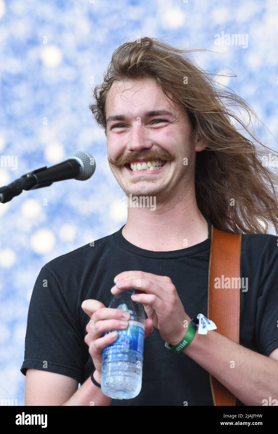 Singer, songwriter and guitarist Joshua Harmon is shown performing on