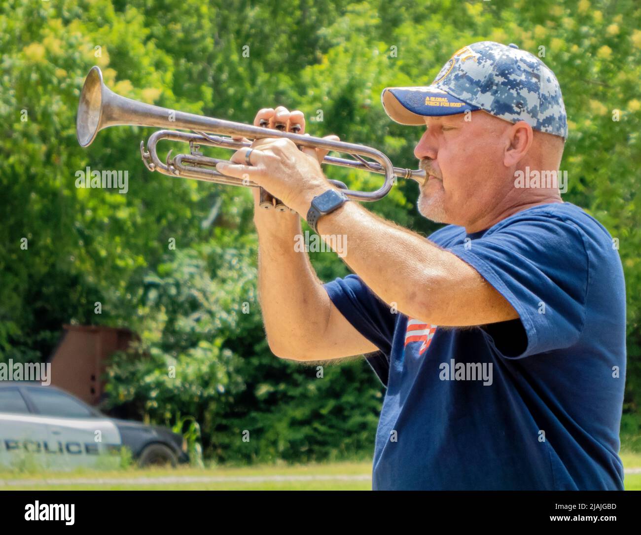 United States Navy veteran Roger Tabor plays 'Taps' on his trumpet as part of the Taps Across America national moment of remembrance on Memorial Day, Monday, May 30, 2022 at the Jake's Place park pavilion in Oak Point, Denton County, TX, USA. A 3 p.m. local time moment of remembrance on Memorial Day began being celebrated nationally in 2000, but Taps Across America is a newer tradition tracing its roots to 2020 when picnics, parades and other public Memorial Day celebrations had to be cancelled due to the COVID-19 pandemic. (Apex MediaWire Photo by Timothy J. Jones) Stock Photo