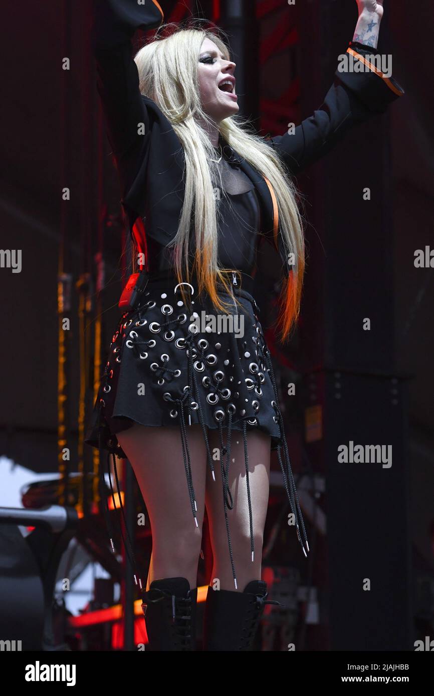 Singer, songwriter, and actress Avril Lavigne is shown performing on stage during a live concert appearance during the Boston Calling music festival held in Allston, Massachusetts on May 27, 2022. Stock Photo