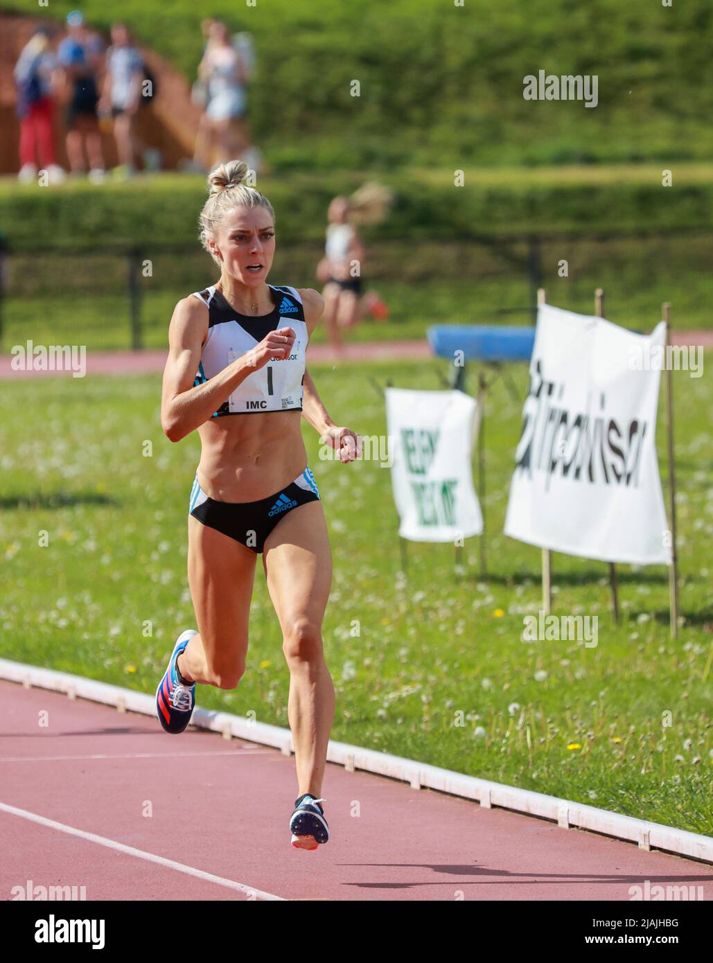 British female track athlete Olympian Alexandra Bell running in 1500m