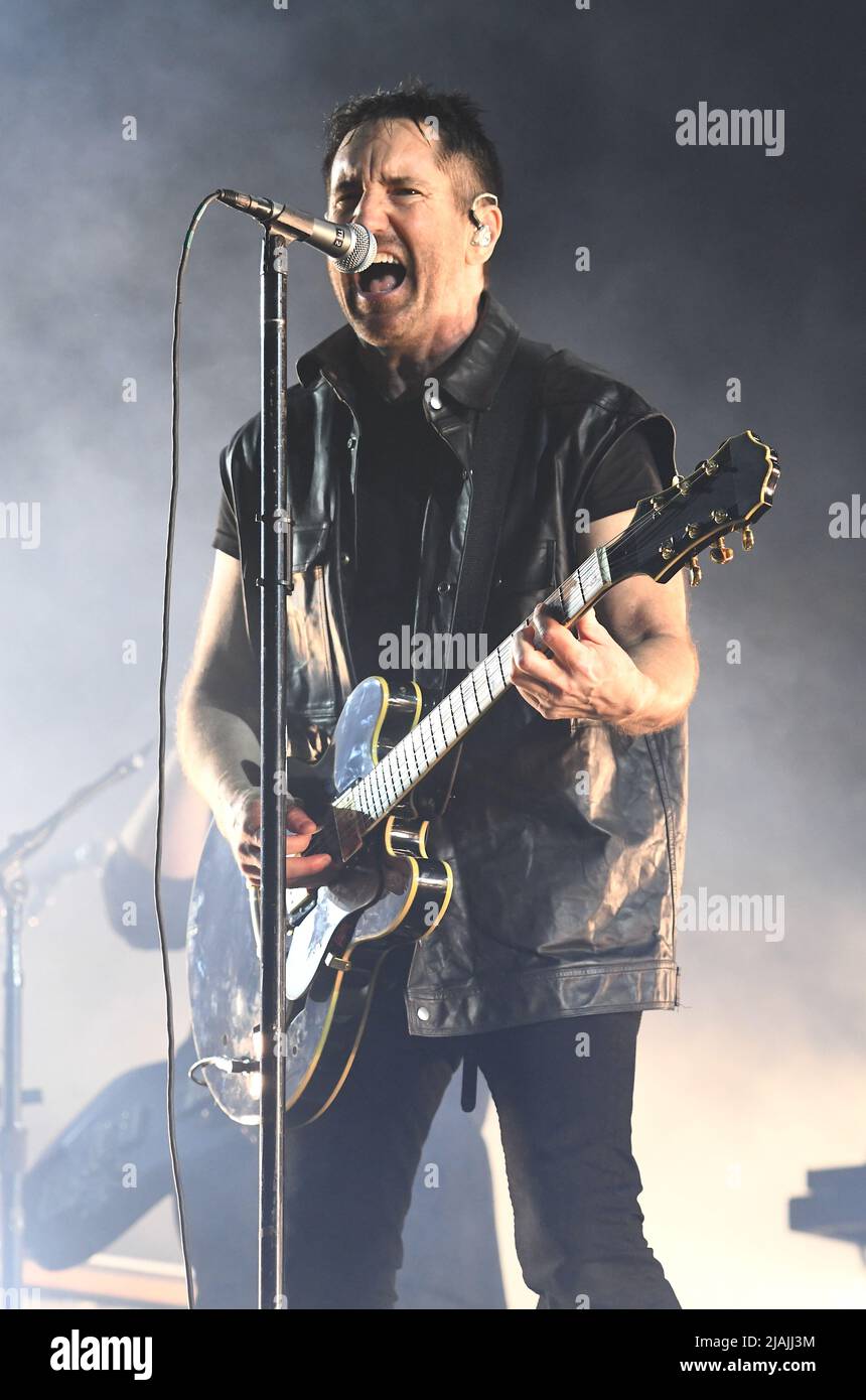 Singer, songwriter, multi-instrumentalist, and producer Trent Reznor is  shown performing on stage during a live concert appearance with Nine Inch  Nails during the Boston Calling music festival held in Allston,  Massachusetts on