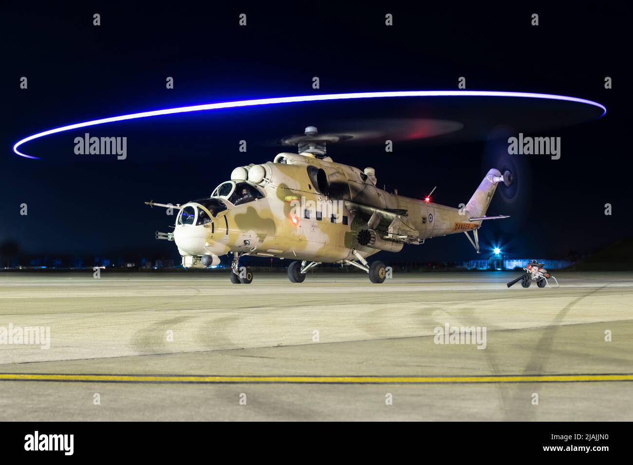 A Cyprus National Guard Air Wing Mi-35 Hind prepares for takeoff at night, Cyprus. Stock Photo