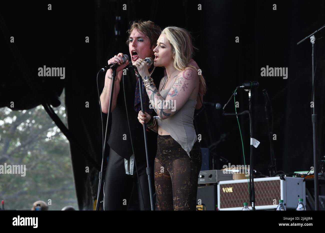 Lead singer Luke Spiller and special guest Paris Jackson are shown performing on stage during a live concert appearance The Struts during the Boston Calling music festival held in Allston, Massachusetts on May 27, 2022. Stock Photo