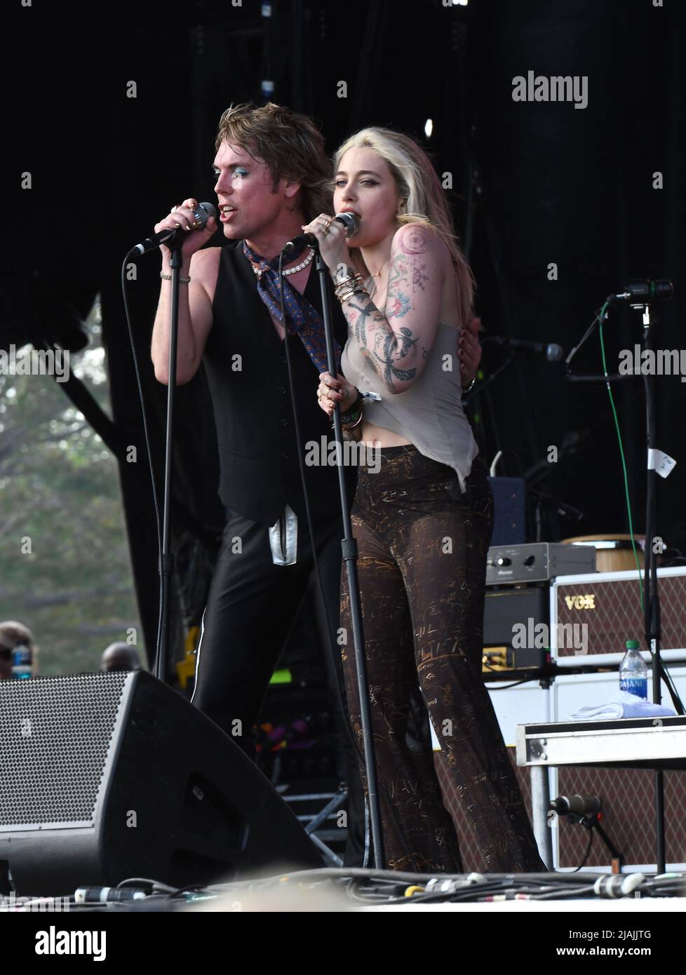Lead singer Luke Spiller and special guest Paris Jackson are shown performing on stage during a live concert appearance The Struts during the Boston Calling music festival held in Allston, Massachusetts on May 27, 2022. Stock Photo