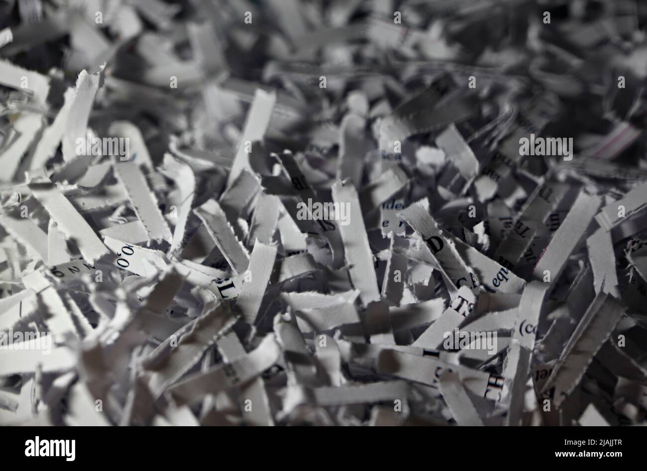 Paper shredder, cross cut shredded paper falling into bin Crosscut