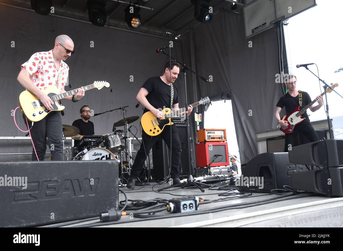 The Dutch Tulips, Matthew Freake, Justin Mantell, and brothers Matthew and John Holland, are shown performing on stage during a live concert appearance at the Boston Calling music festival held in Allston, Massachusetts on May 29, 2022. Stock Photo