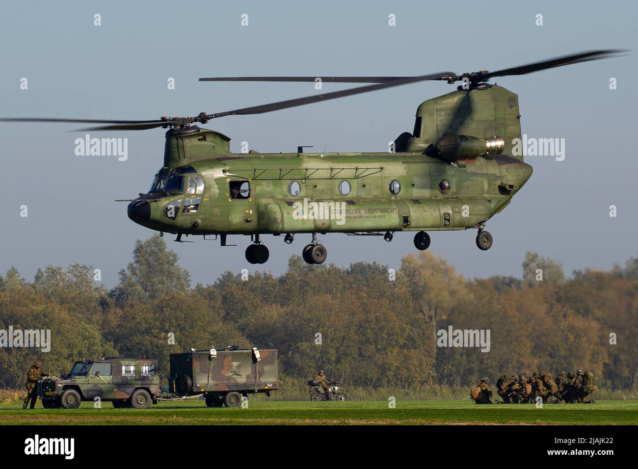 A Royal Netherlands Air Force CH-47 Chinook takes off during a military exercise. Stock Photo