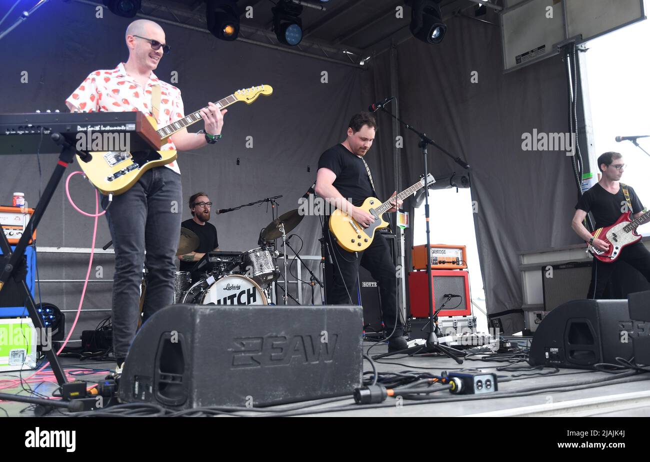 The Dutch Tulips, Matthew Freake, Justin Mantell, and brothers Matthew and John Holland, are shown performing on stage during a live concert appearance at the Boston Calling music festival held in Allston, Massachusetts on May 29, 2022. Stock Photo