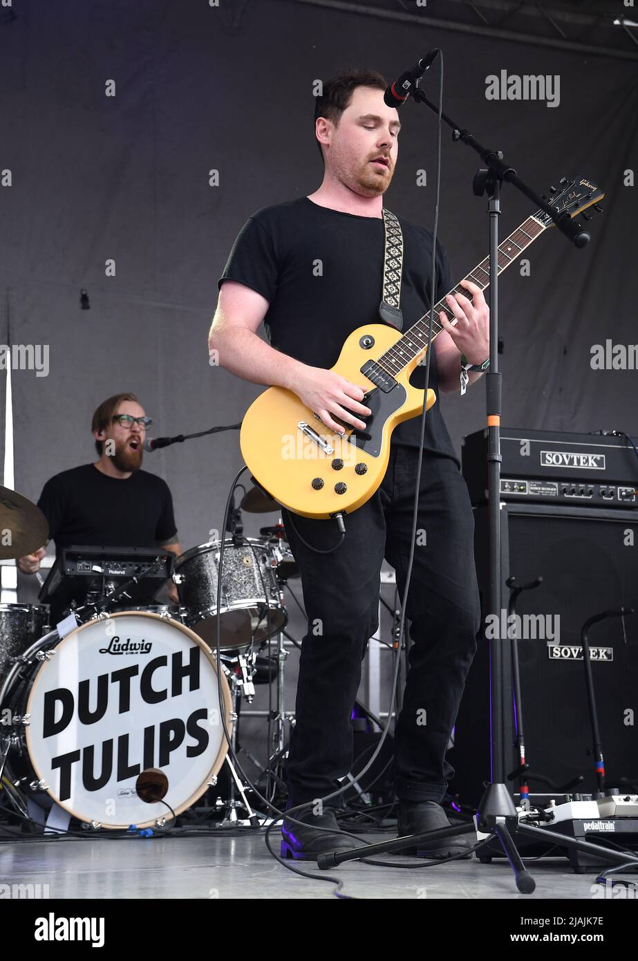 The Dutch Tulips, Matthew Freake, Justin Mantell, and brothers Matthew and John Holland, are shown performing on stage during a live concert appearance at the Boston Calling music festival held in Allston, Massachusetts on May 29, 2022. Stock Photo