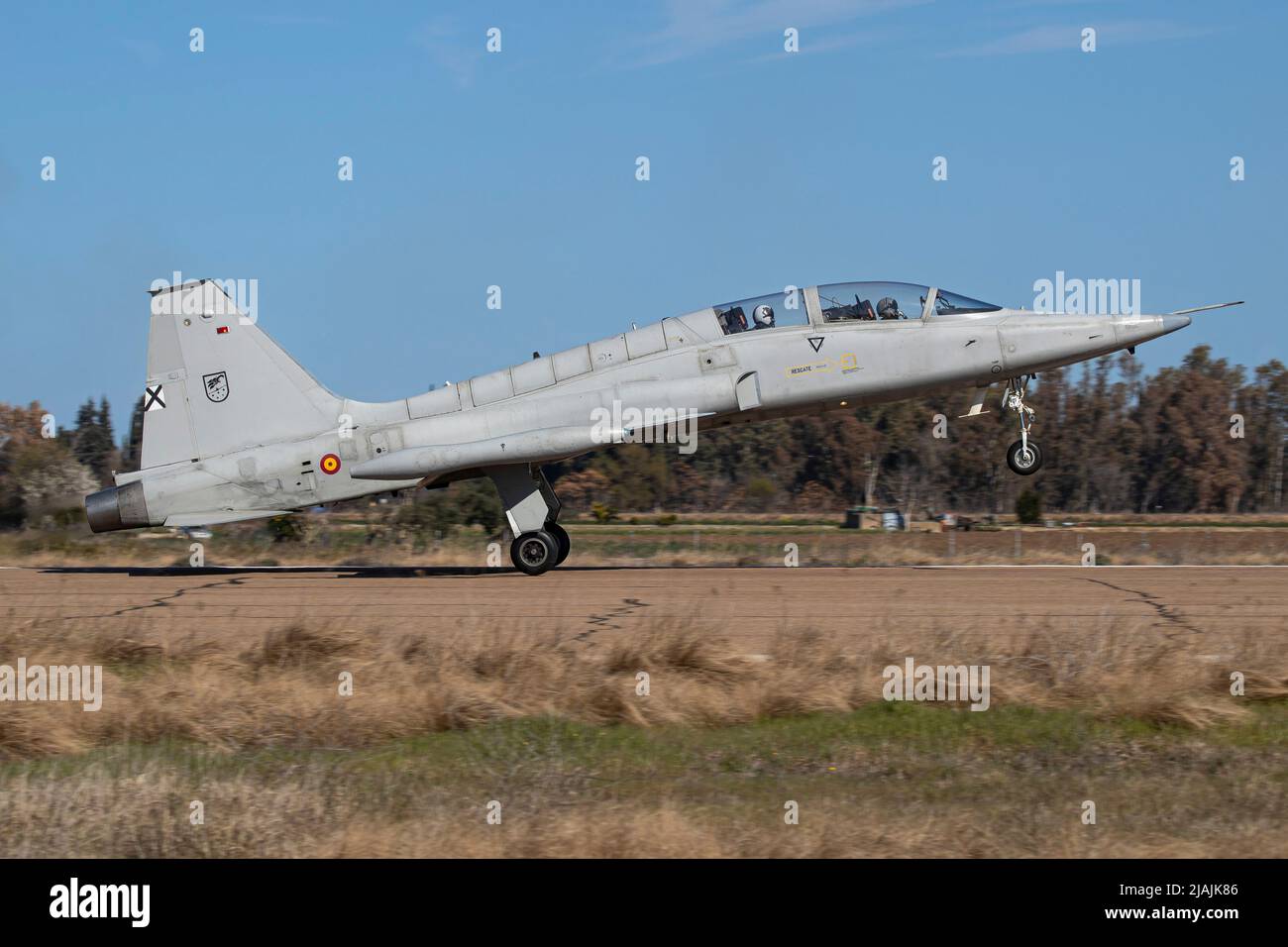 A Spanish Air Force SF-5M Freedom Fighter training jet landing on runway. Stock Photo