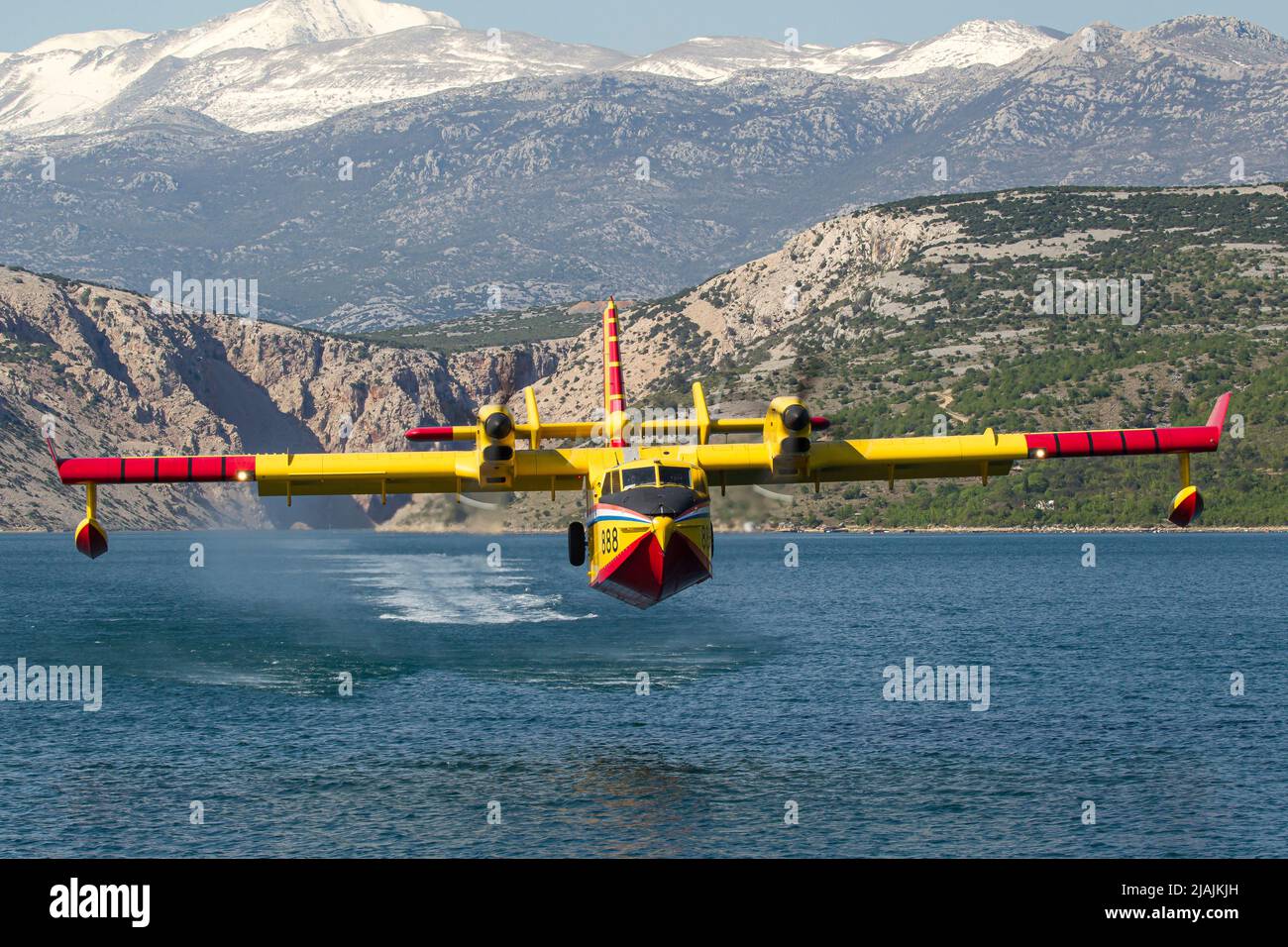 A Croatian Air Force CL-415 Super Scooper firefighting aircraft taking off from the water, Croatia. Stock Photo