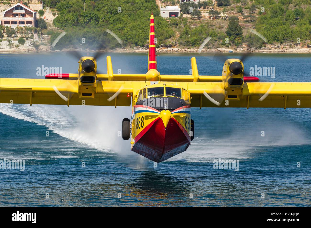 A Croatian Air Force CL-415 Super Scooper firefighting aircraft taking off from the water, Croatia. Stock Photo