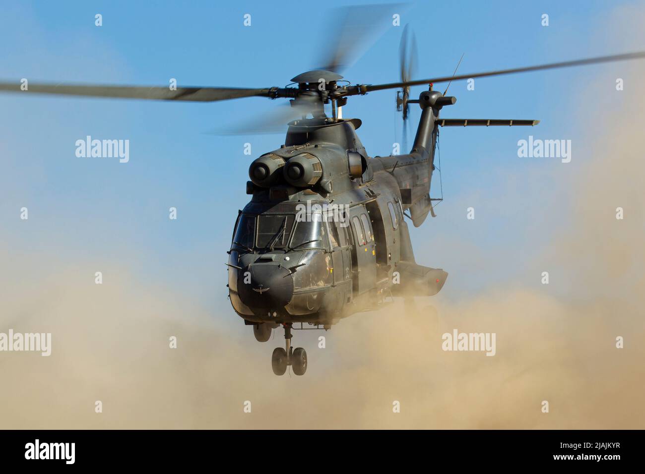 A Spanish Army AS332 Super Puma taking off from a beach at the island of Lanzarote. Stock Photo